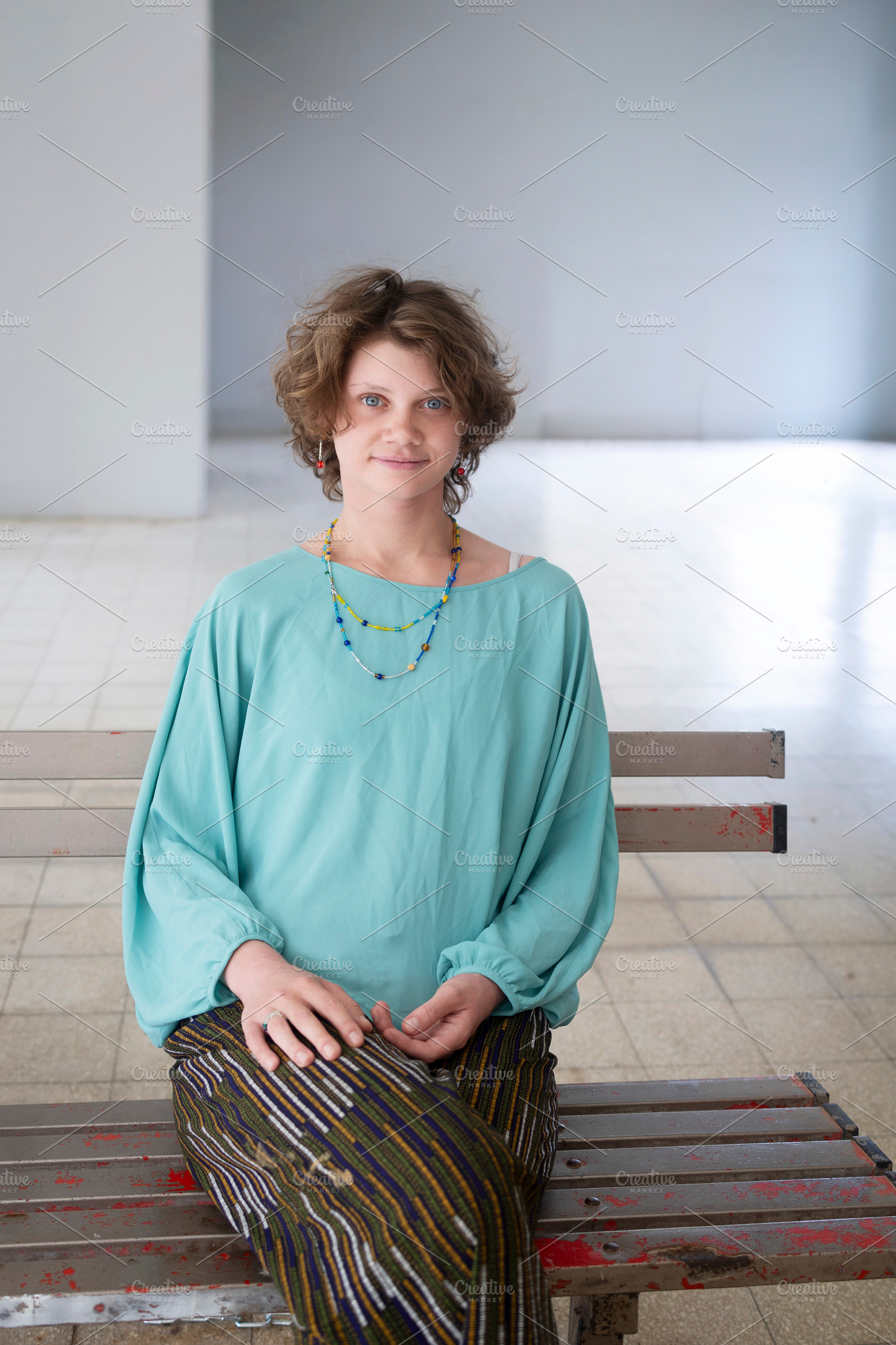 A young woman with curly brown hair, a Person Photo by Imaginarium