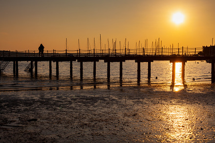 The pier at sundown. Wooded bridge seaside with Sunset, Strunjan, a Nature Photo by Bepslabor