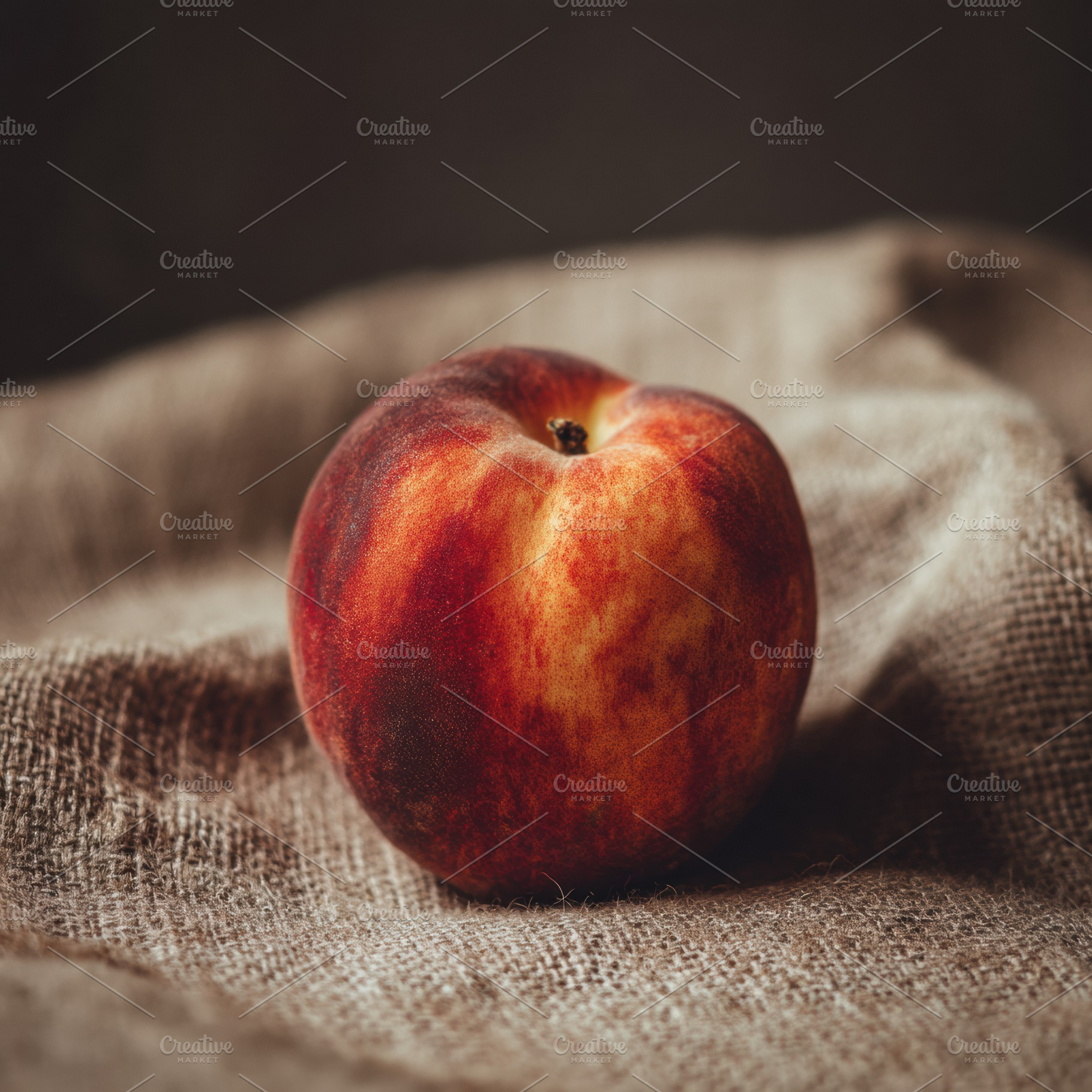 One peach on natural jute background, a Photo by Virgo Studio