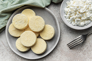 Frozen cottage cheese pancakes ready for cooking, a Food & Drink Photo by Olena Rudo