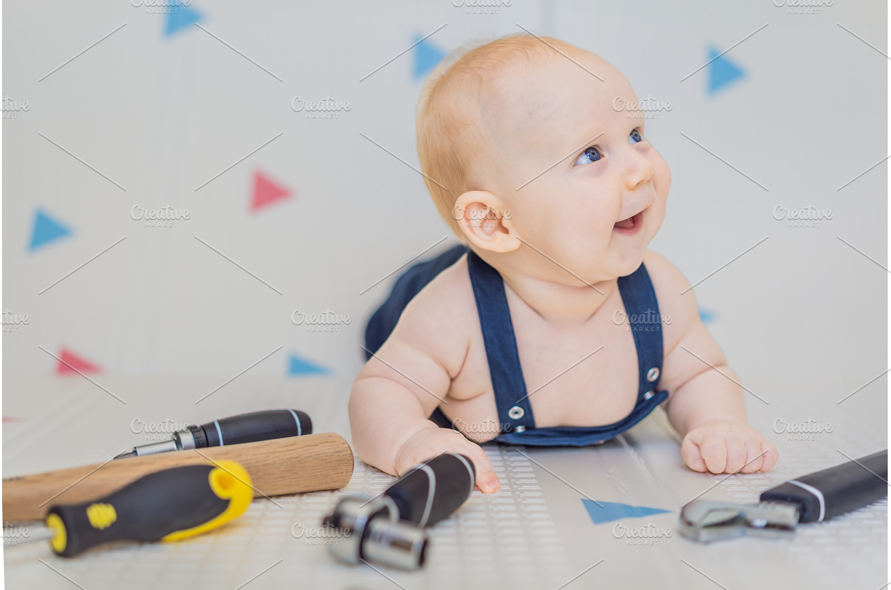 Adorable baby in a mechanic costume, a Person Photo by Elizaveta Galitskaya