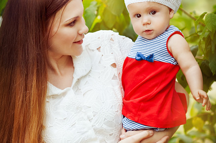Beautiful young mother and baby, a Person Photo by Daria Photo