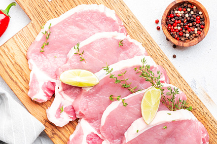 Raw pork chops, loin  on wooden cutting board prepared for cooki, a Food & Drink Photo by 5PH