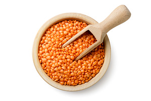 Red lentils in a wooden plate with a, a Food & Drink Photo by innakreativ