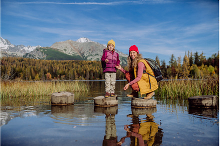 Mother with daughter standing on, a Sports & Recreation Photo by HalfPoint