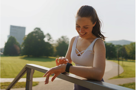 Young sporty woman checking her, a Sports & Recreation Photo by HalfPoint