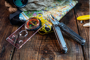 Map, compass and pliers. Orientation, a Sports & Recreation Photo by Stockphoto by vzwer