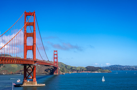 Golden Gate Bridge over blue waters with scenic hills in San Fra, an Architecture Photo by GoodGoods
