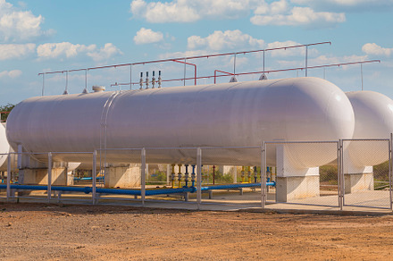 Natural Gas storage tanks in industrial plant, an Industrial Photo by Casanowe-studio