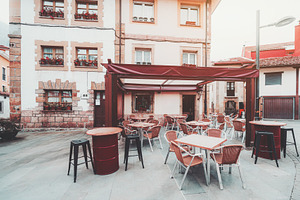 Empty cafe terrace in old town, an Industrial Photo by SkyNext