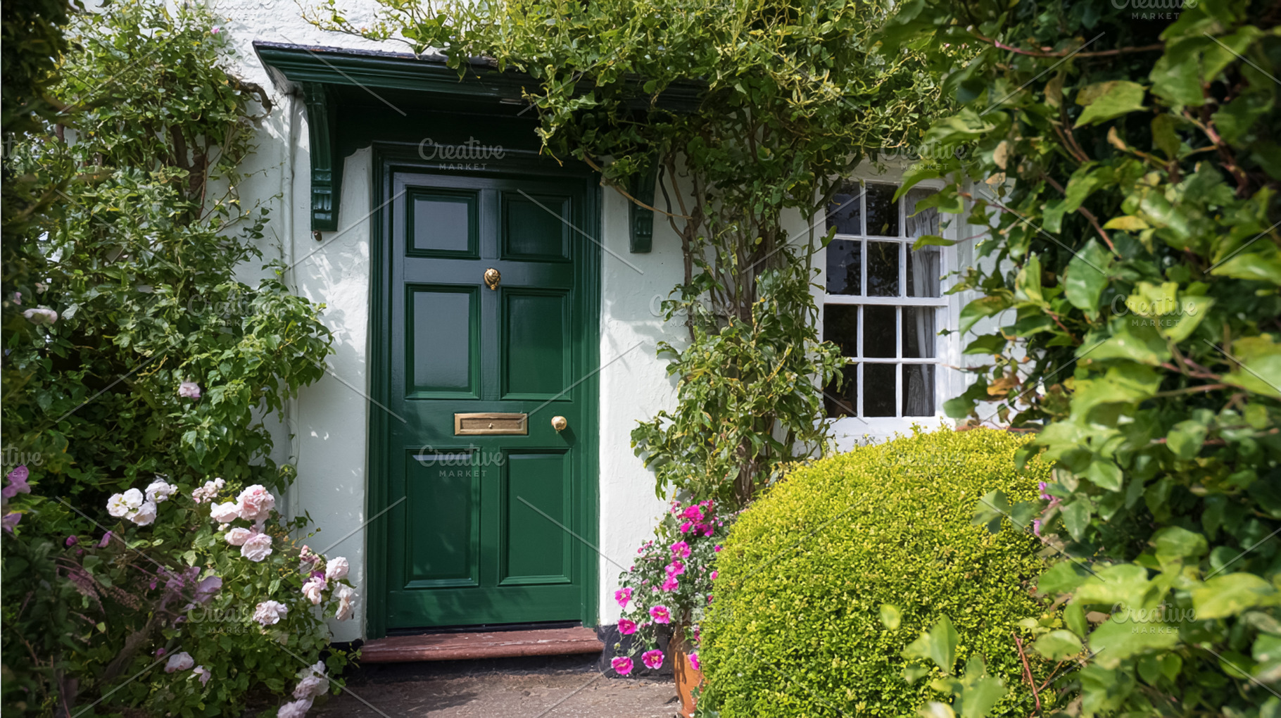 Charming green door of a traditional cottage, surrounded by clim, a Photo by Studio ANNA