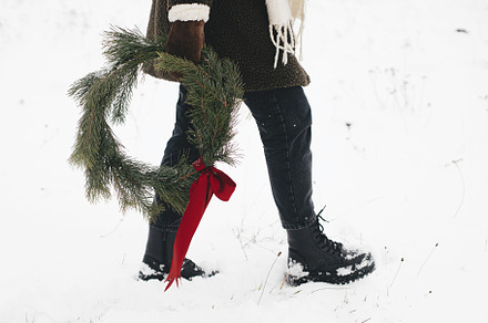 Merry Christmas! Stylish woman with christmas wreath in winter p, a Holiday Photo by Sonjachni