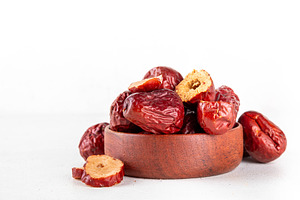 Bowl of dried unabi or jujube berry fruits, Chinese dates, a Food & Drink Photo by Rimma