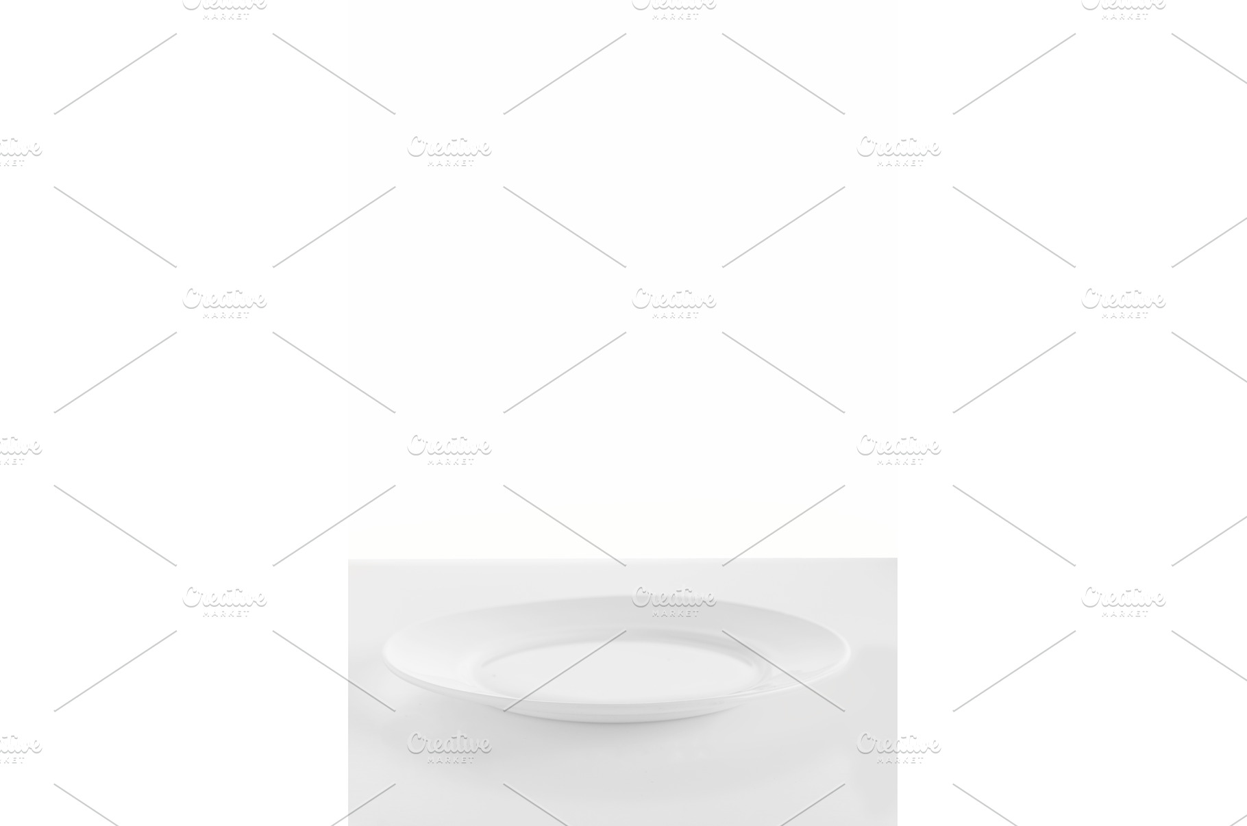 Empty white plate on a white, a Food & Drink Photo by Stockphoto by vzwer