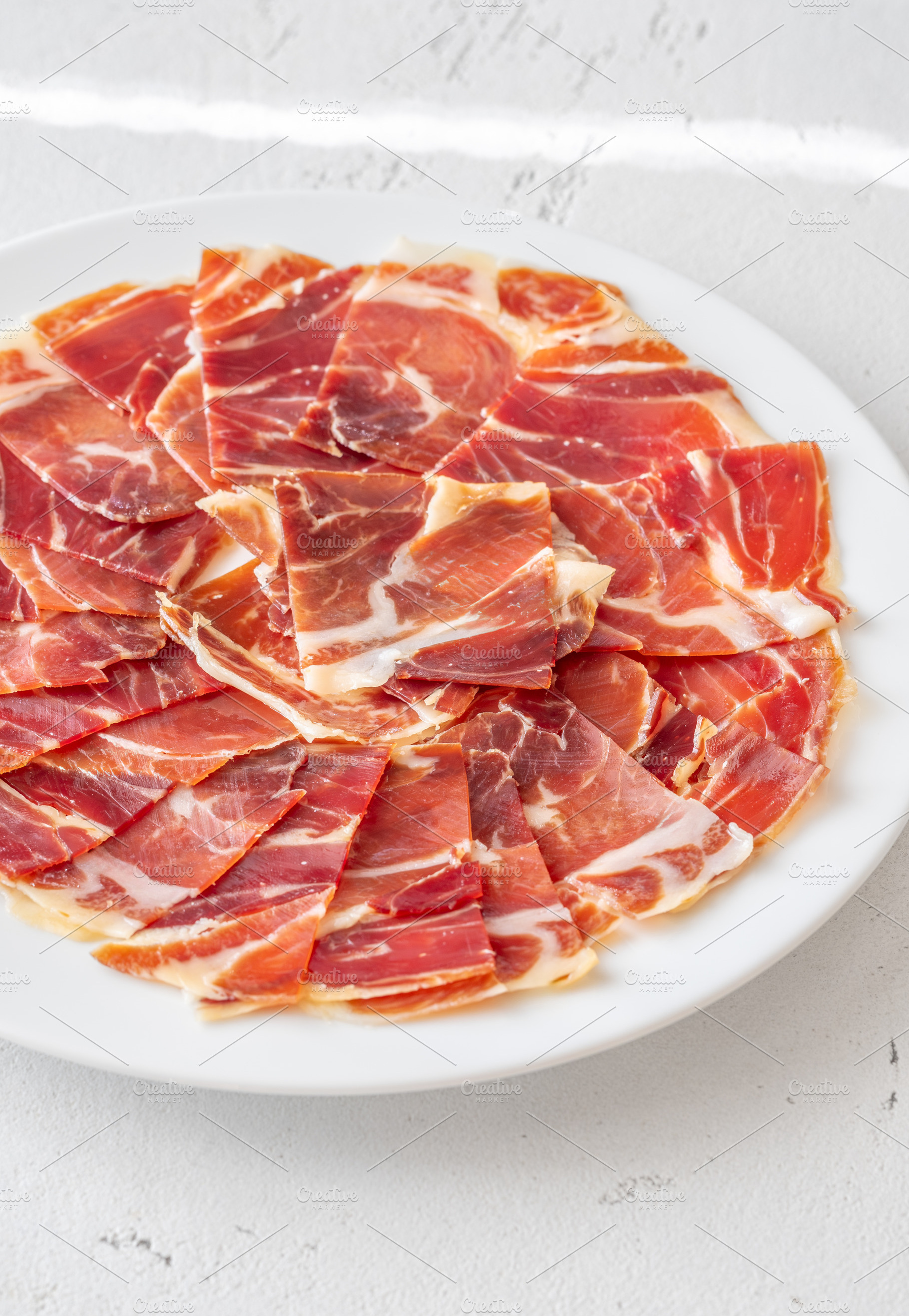 Thin Slices of Jamon Iberico, a Food & Drink Photo by Alexander Prokopenko
