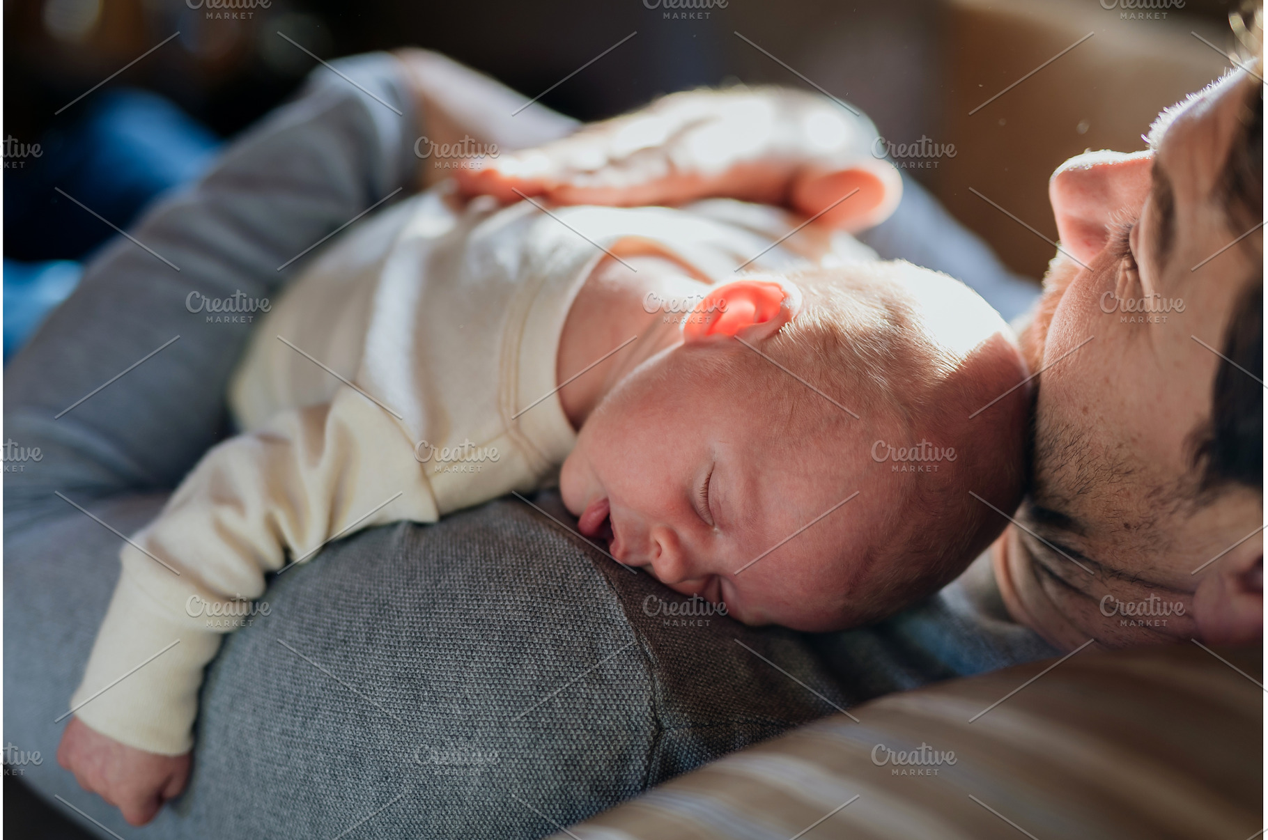 Close-up of father holding his, a Person Photo by HalfPoint