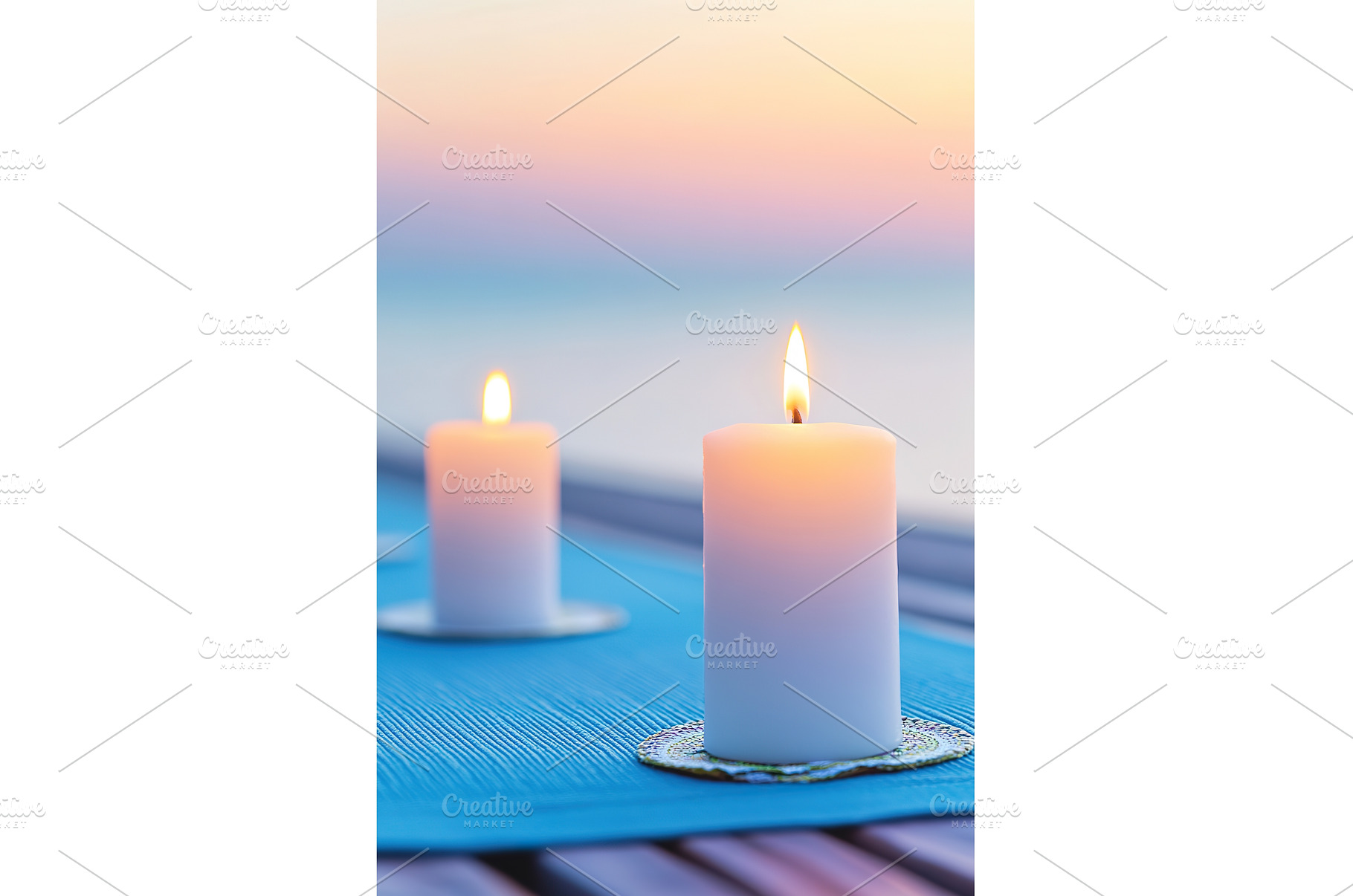 Illuminated Candles Sit Atop Blue, a Background Photo by Lermont51