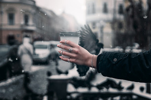 A girl's hand hold coffee