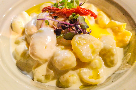 Creamy gnocchi with dried tomato and microgreens, a Food & Drink Photo by DanFLCreativo