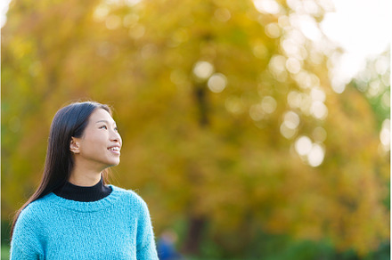 Distracted asian woman looking up in, a Person Photo by Iván Moreno STOCK PHOTO