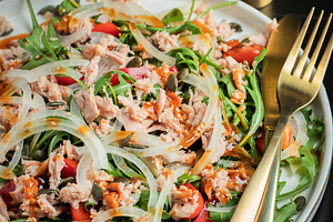 Fresh Tuna Salad with Onions and Cherry Tomatoes. Italian Mediterranean Cuisine, a Food & Drink Photo by Budarinphoto