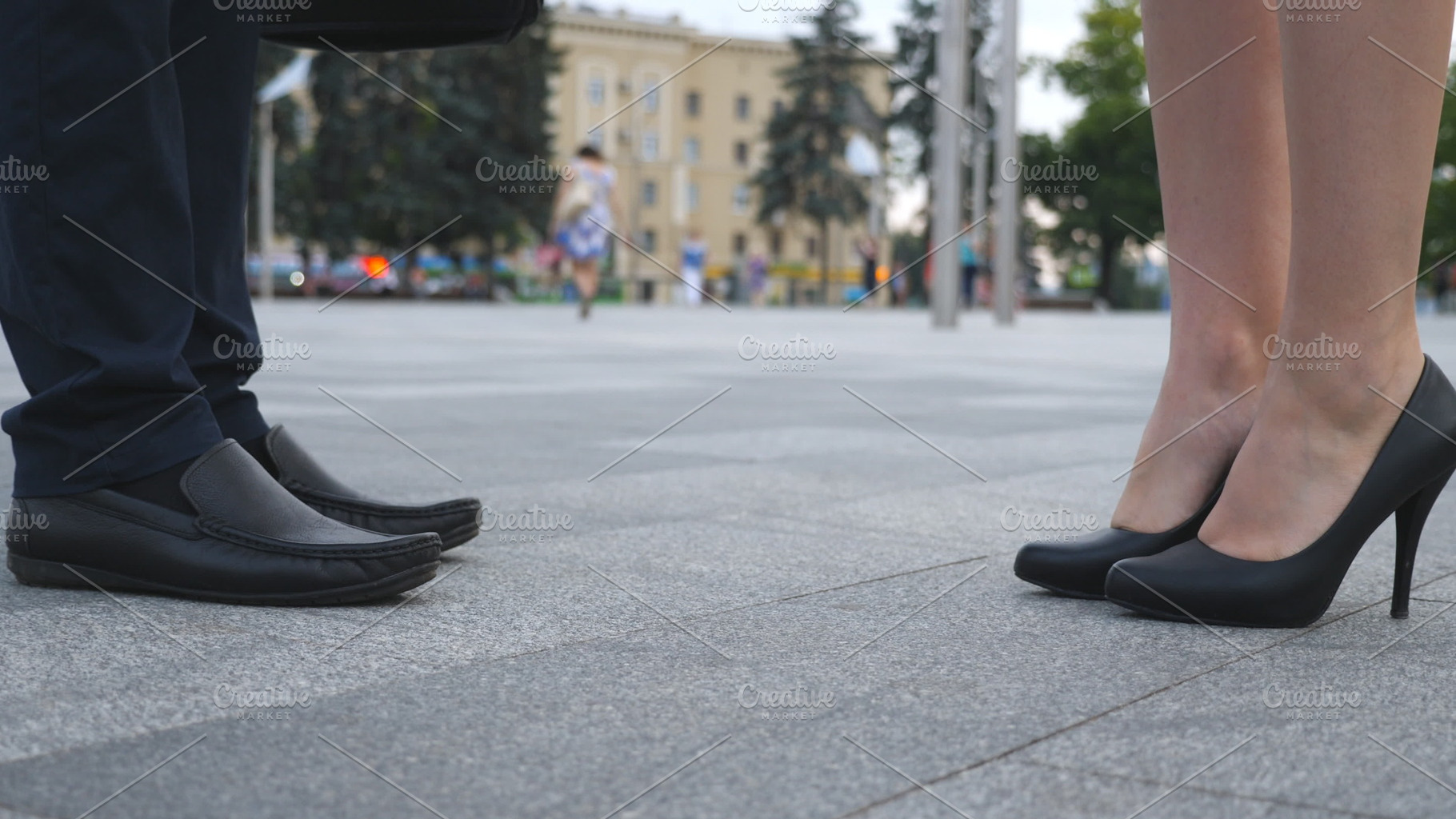 Businessman and businesswoman meeting at city street and greeting each other, a Business Photo by Footage Autor