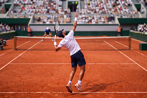 Tennis Player Serving on Clay Court, a Sports & Recreation Photo by Davizro's Market