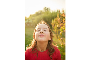 Girl enjoys the warmth of sunlight, a Nature Photo by IlliaBondarPhotography