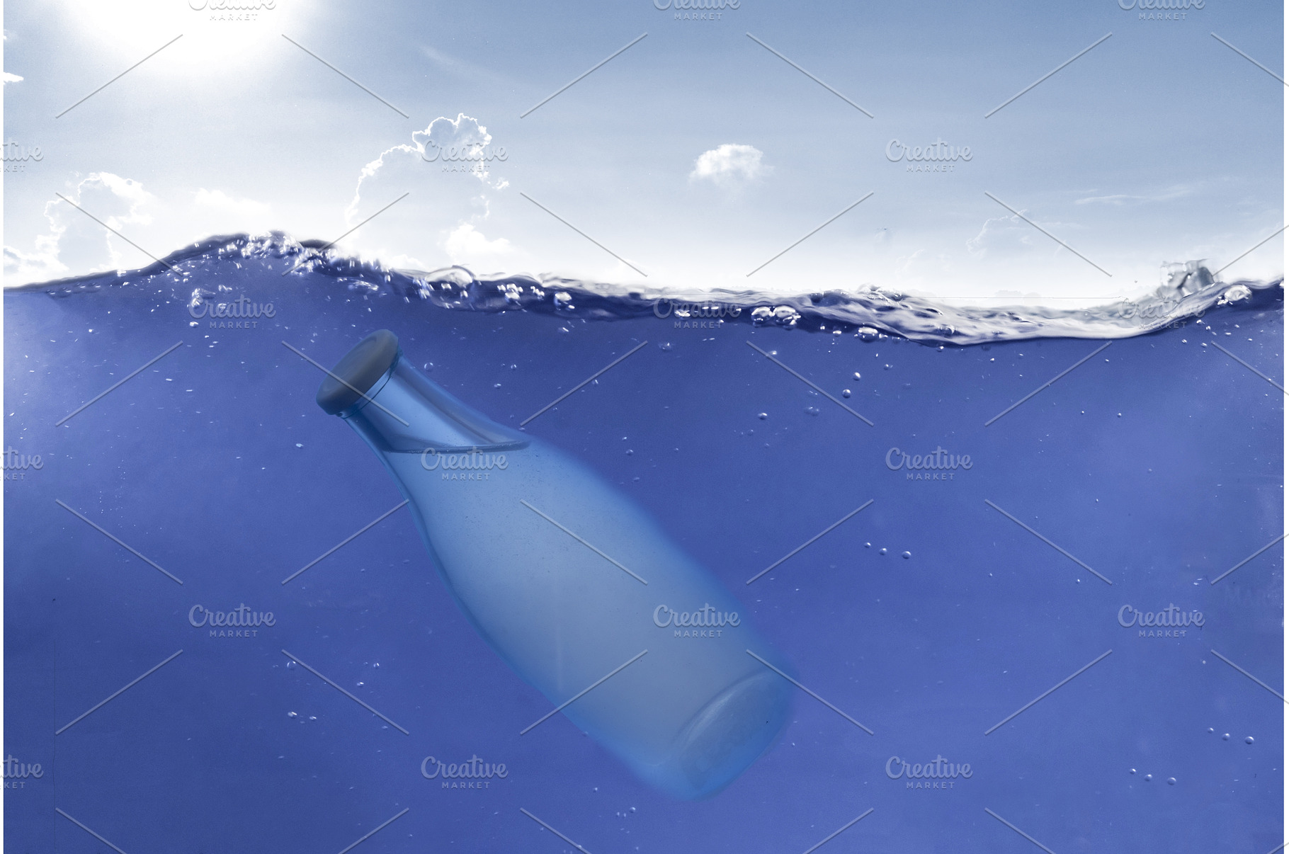 transparent glass bottle underwater, a Nature Photo by Mikee's stuff