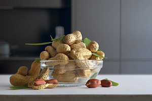 Bowl with shelled peanuts in a dark kitchen, a Food & Drink Photo by Davizro's Market