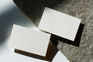 Simple blank business cards on stone, a Photo by Beautiful things