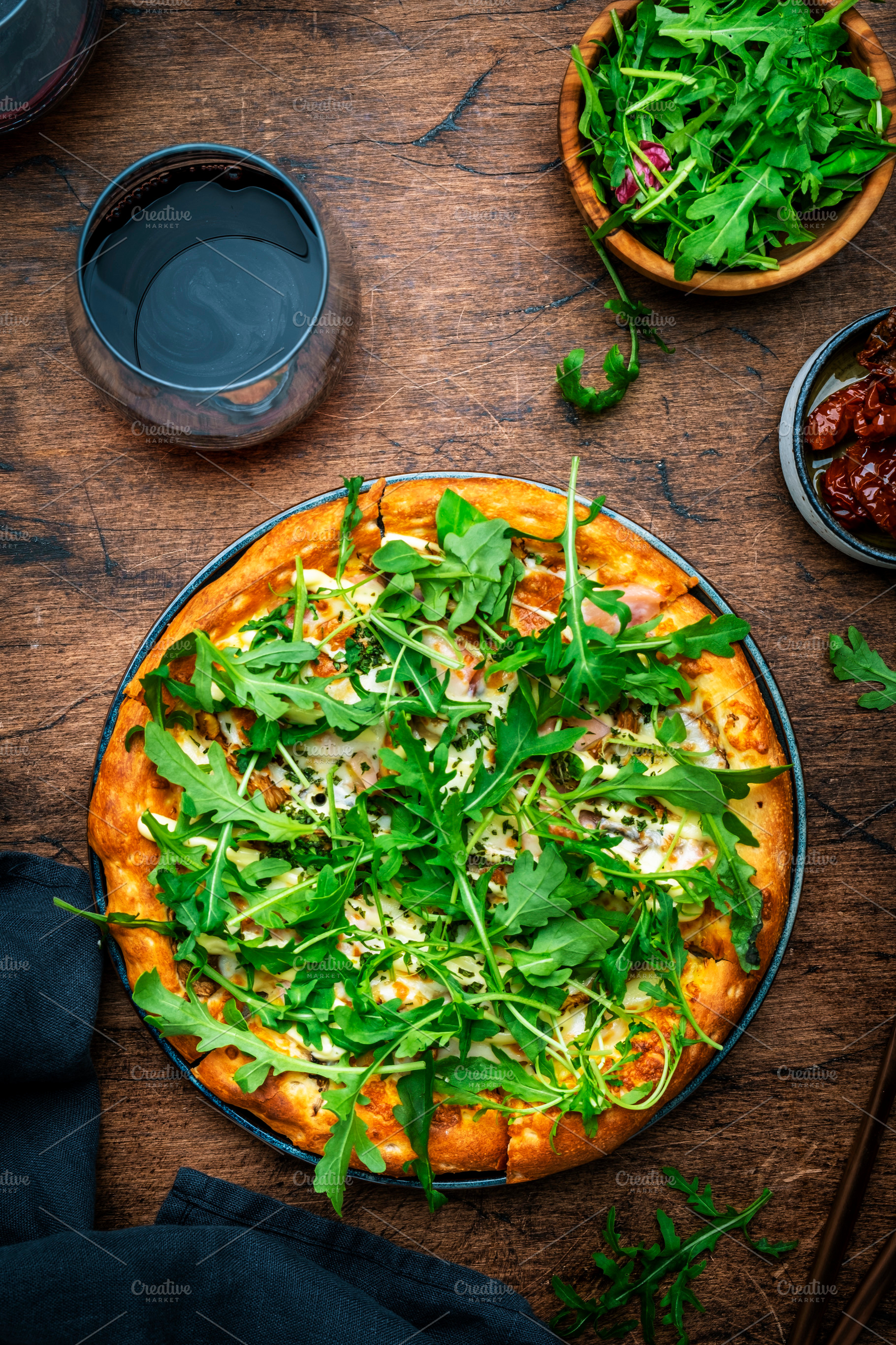 Hot pizza with mozzarella cheese, ham, pesto sauce and fresh aru, a Food & Drink Photo by 5PH