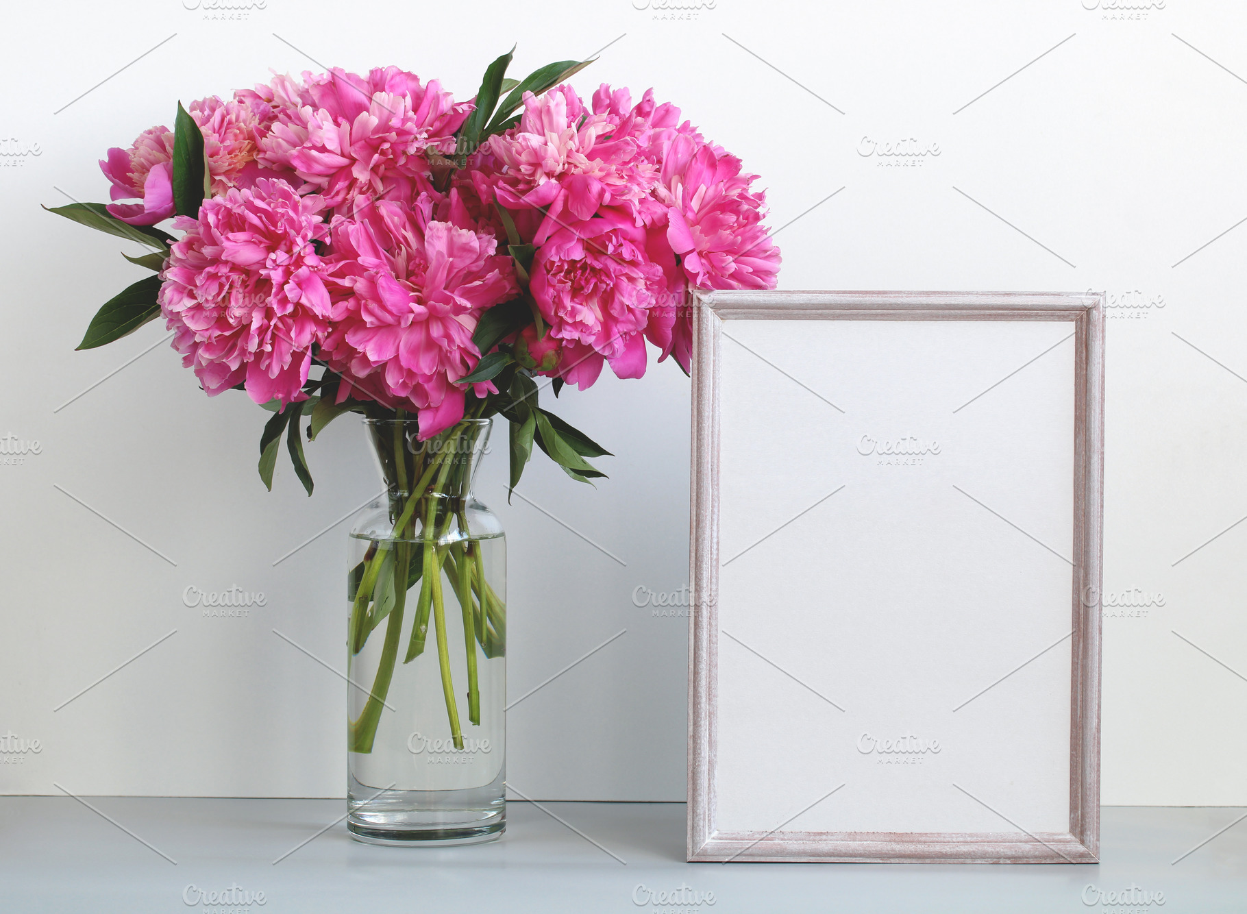 pink peonies and an empty frame, a Background Photo by BalaguR