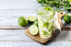 Fresh mojito cocktail with lime, mint and ice in glass, a Food & Drink Photo by etorres69