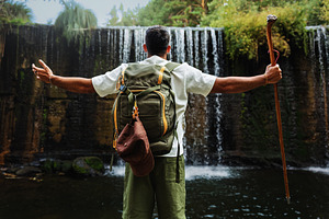 Hiker with walking stick in front of, a Person Photo by Perpis