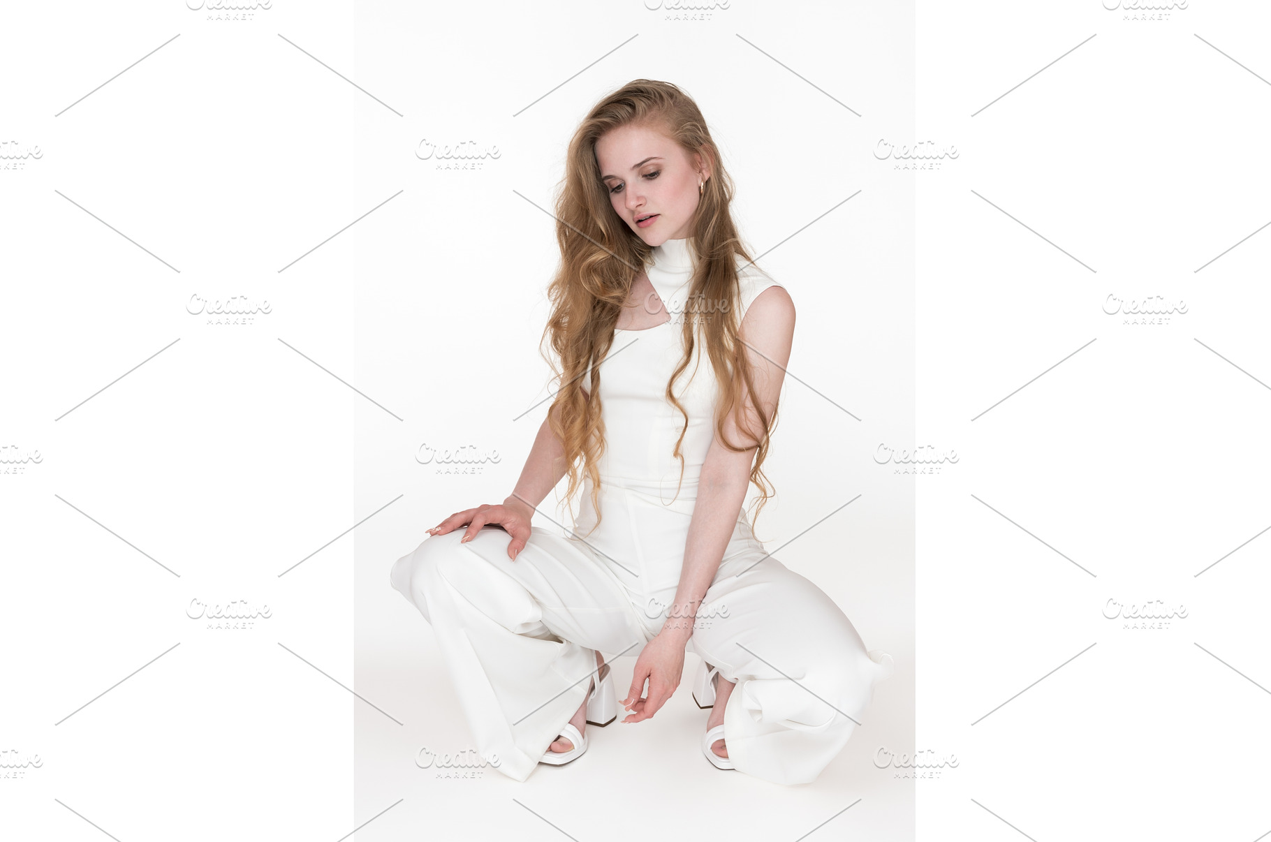 Shy blondie woman sitting squatting, a Person Photo by Alexander-Piragis