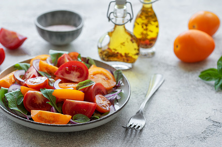 Green salad from leaves and tomatoes, a Food & Drink Photo by Olena Rudo