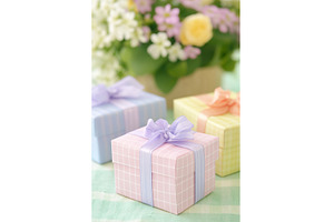 Pastel gift boxes with ribbons in a, a Background Photo by Lermont51