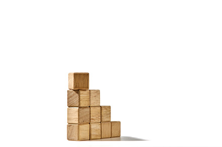 Wood cubes stacked as stair step shapes on white, a Business Photo by 1981 Rustic studio kan