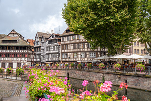 Half-timbered houses reflected in the canal Petite France, Stras, an Architecture Photo by GoodGoods