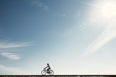 Girl enjoying bike ride silhouette, a Person Photo by Sergey Furtaev