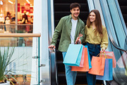 Cheerful Couple Shopping Spending Time In Modern Mall, a Photo by Prostock-Studio (Thumbnail 1 of 2)