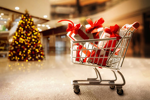Shopping cart full of gift packages in shopping center, a Holiday Photo by Davizro's Market