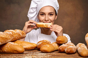 Female Baker Tasting Fresh Bread in Studio, a Food & Drink Photo by Davizro's Market