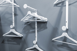 Empty hangers on a clothes rack, a Beauty & Fashion Photo by BOOCYS