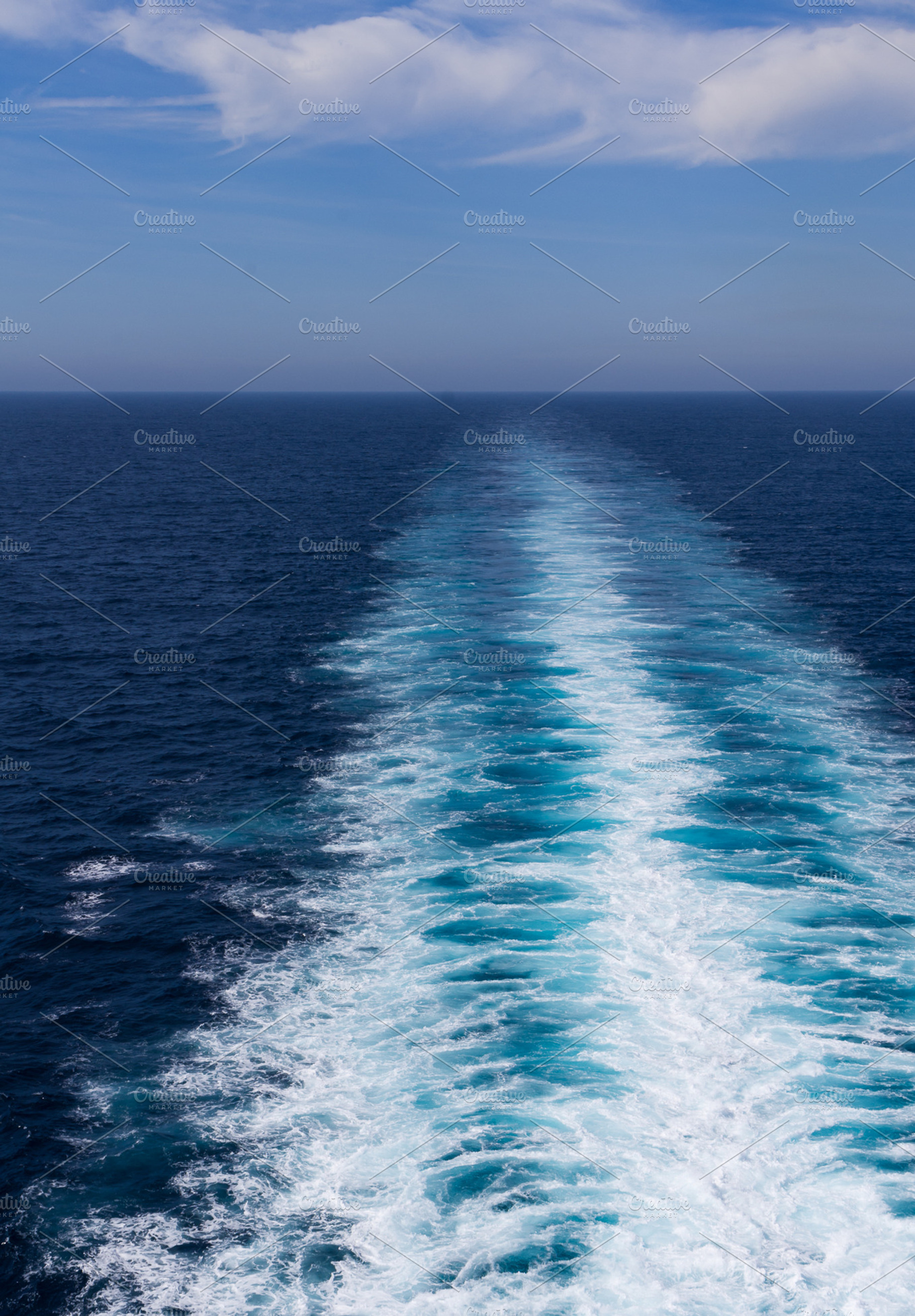 White Wake Trails Behind A Fast Ship