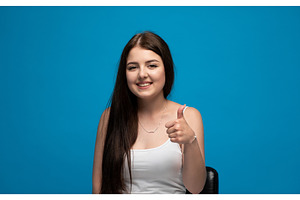 Young woman smiling and giving, a Person Photo by volodymyrshtun13795
