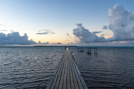 Sunset over the tranquil lagoon of Maupiti, French Polynesia