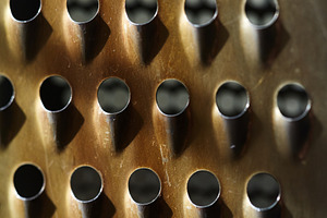 Macro abstract of weathered metal surface with high-contrast shadows. Rhythmic, a Background Photo by Rohan Photography