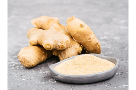 ginger poder and ginger root on gray concrete background, a Food & Drink Photo by Fascinadora